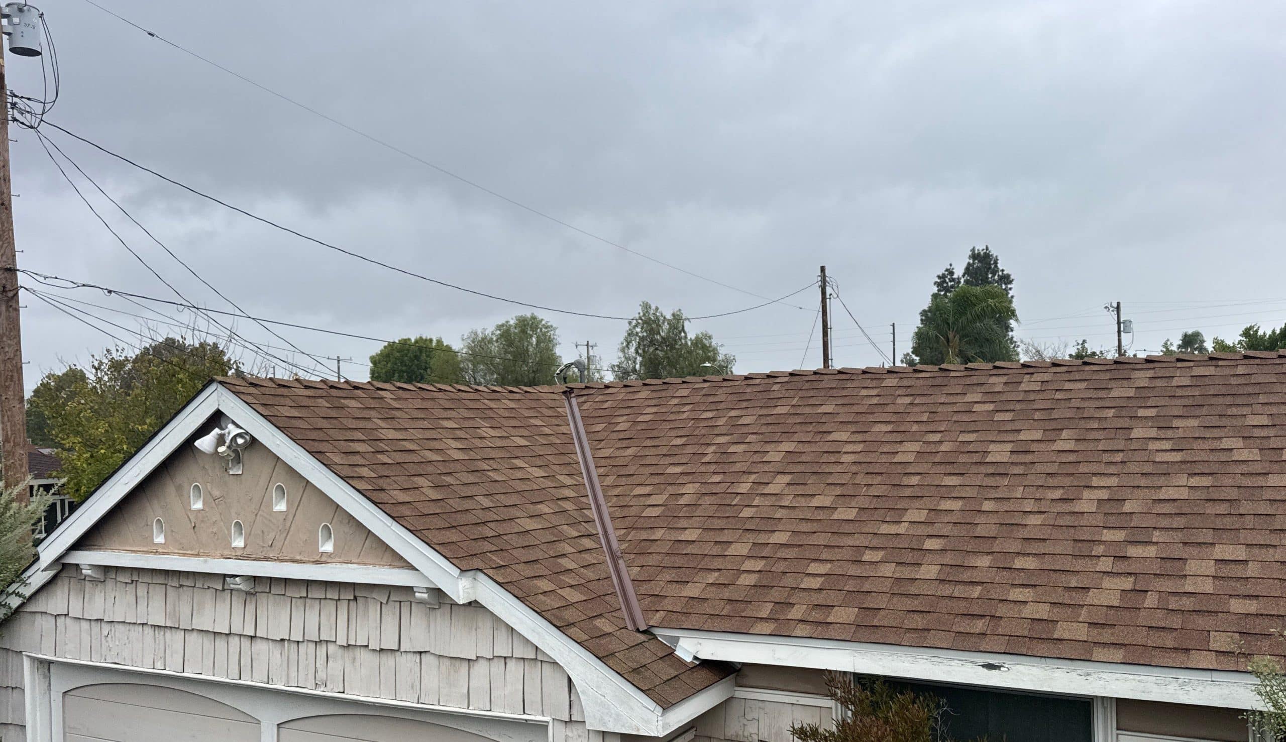 Roofer sealing and repairing a damaged roof section Roofer sealing and repairing a damaged roof section