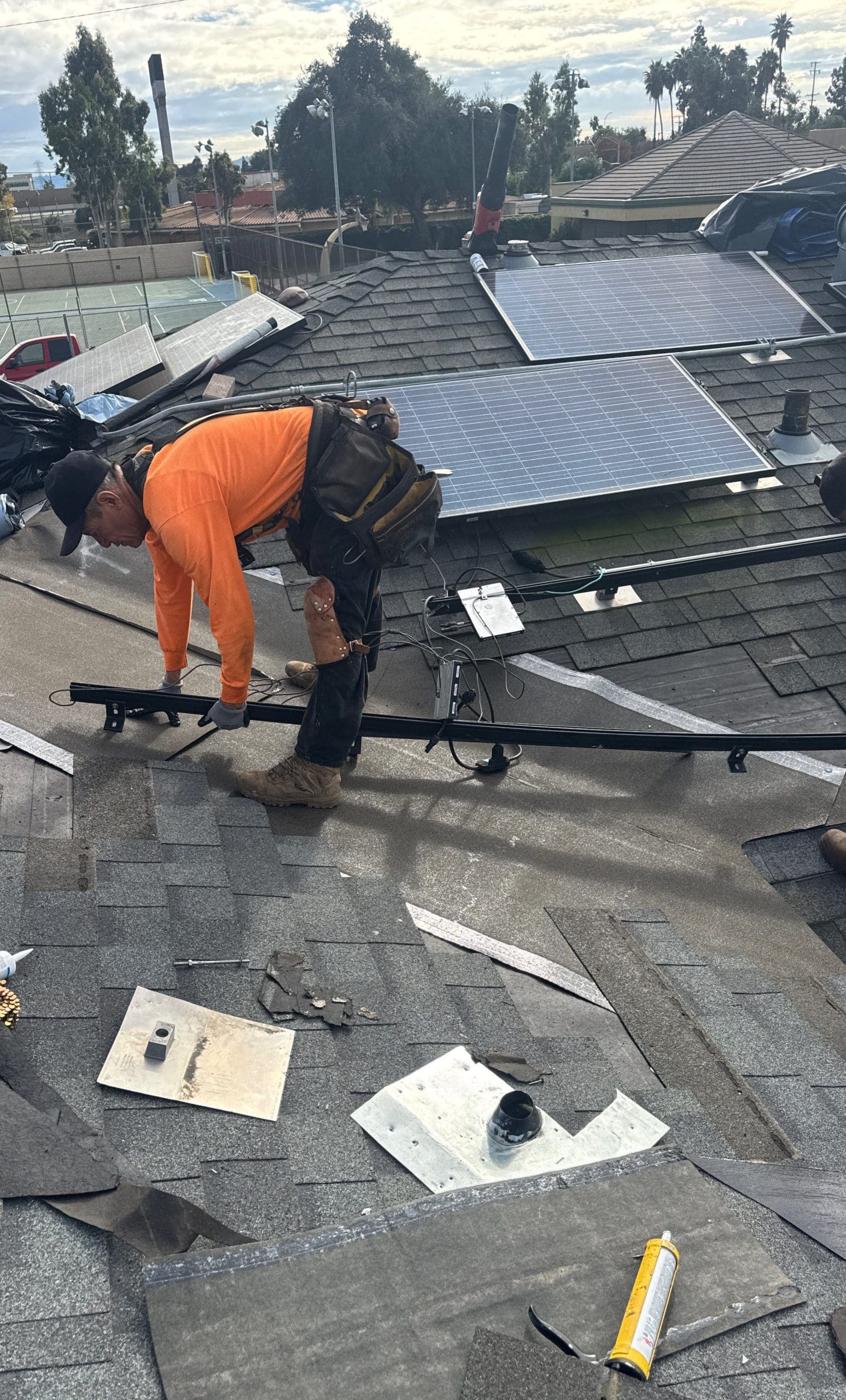 Roof Replacement Inc technician performing a roof repair Roof Replacement Inc technician performing a roof repair