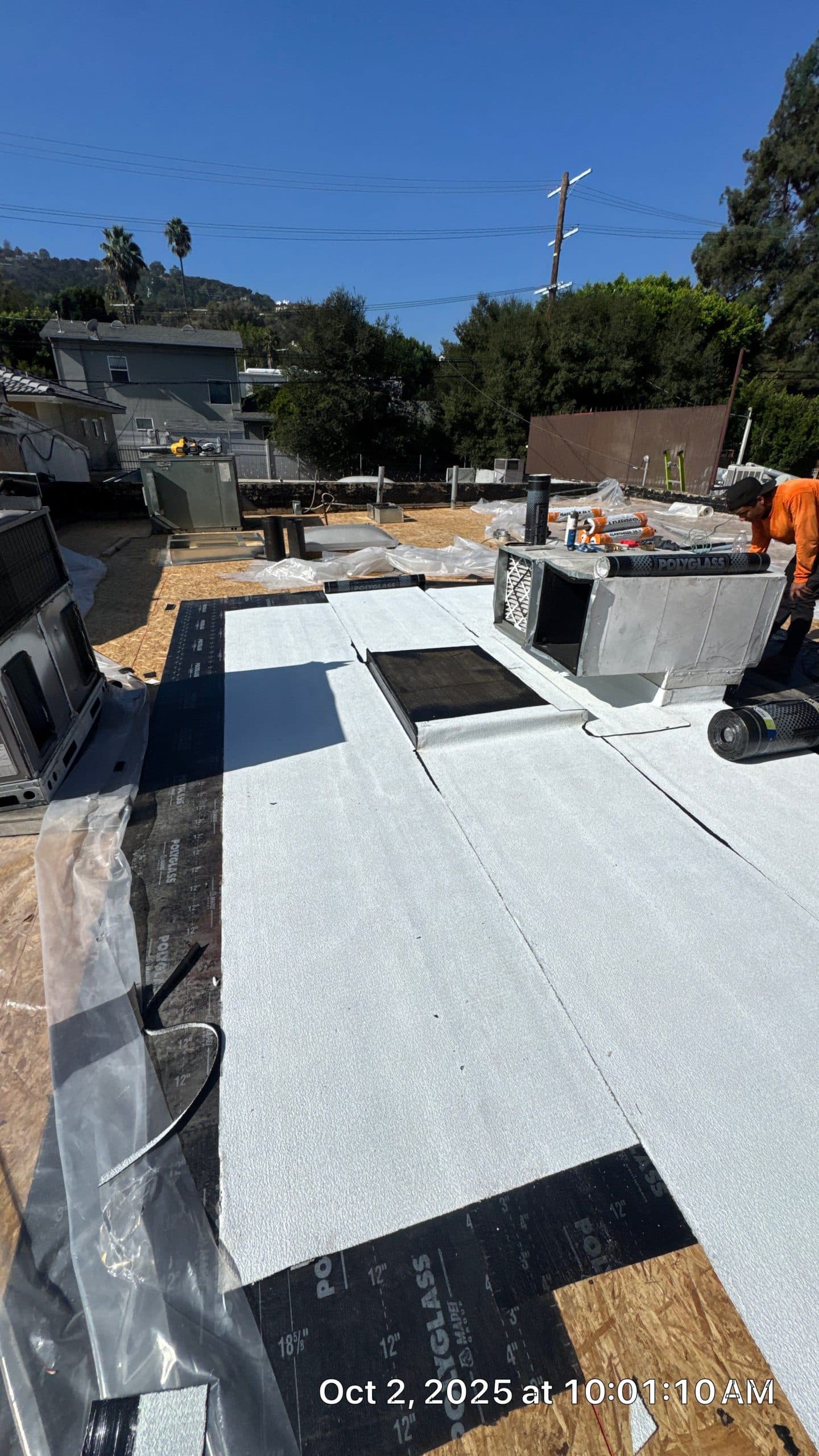 Flat roof under construction with white membrane