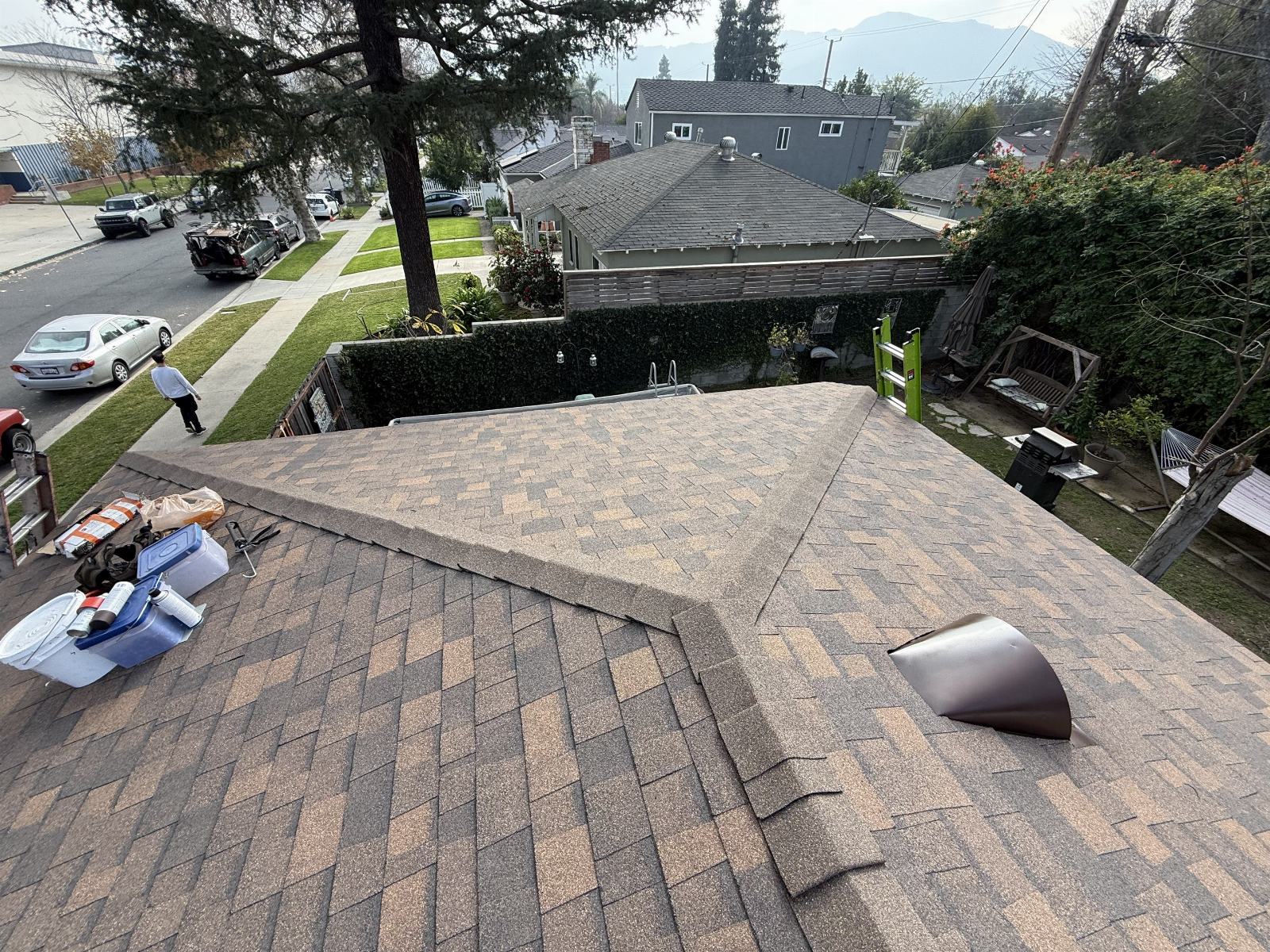New asphalt shingle roof with hip ridge and roof vent installed in Burbank | Roof Replacement Inc new asphalt shingle roof with hip ridge and roof vent installed — Burbank — Roof Replacement Inc