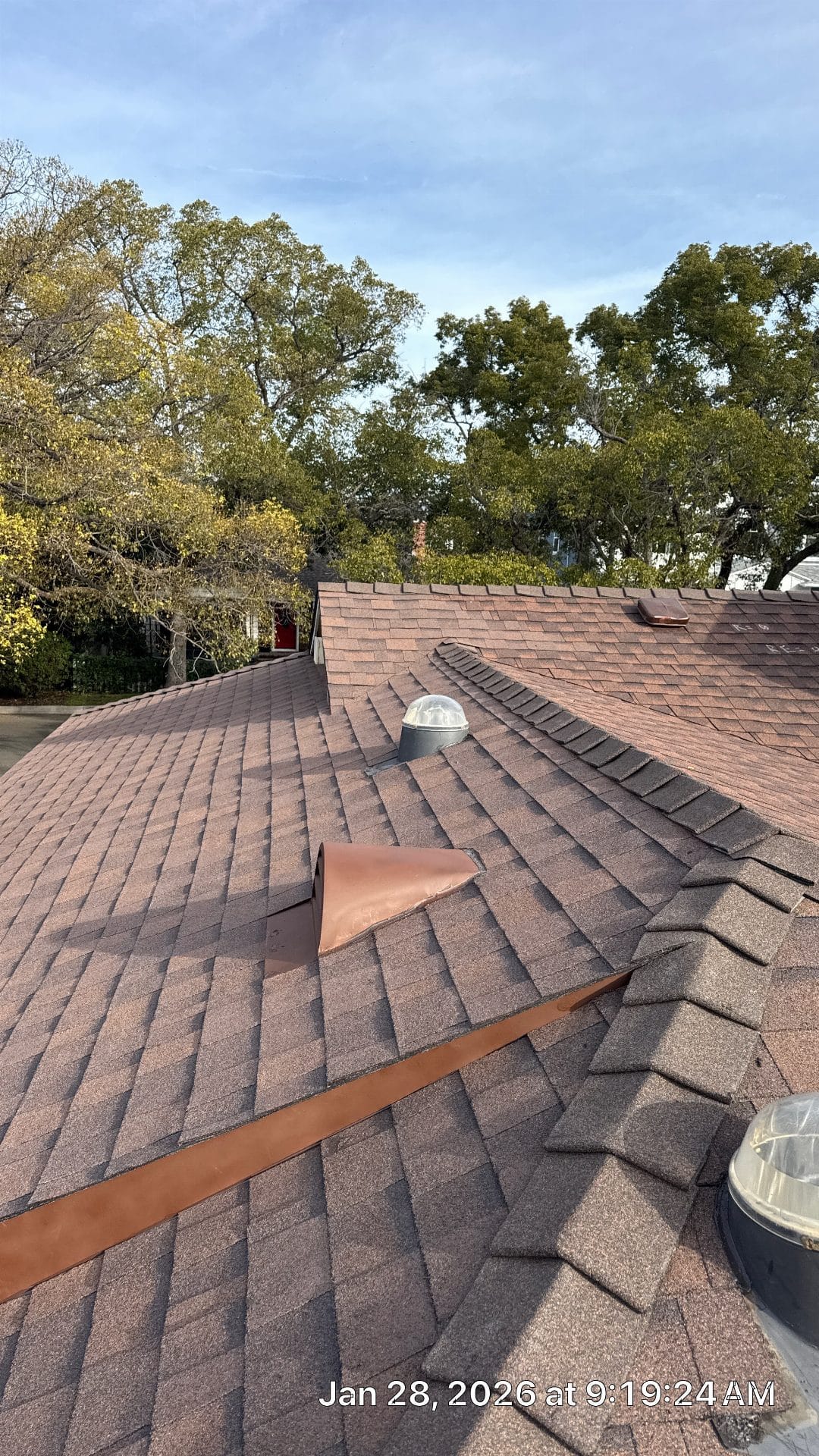 Brown asphalt shingle roof with copper flashing, dome skylights, ridge vents | Roof Replacement Inc Brown asphalt shingle roof with copper flashing, dome skylights, ridge vents — Roof Replacement Inc