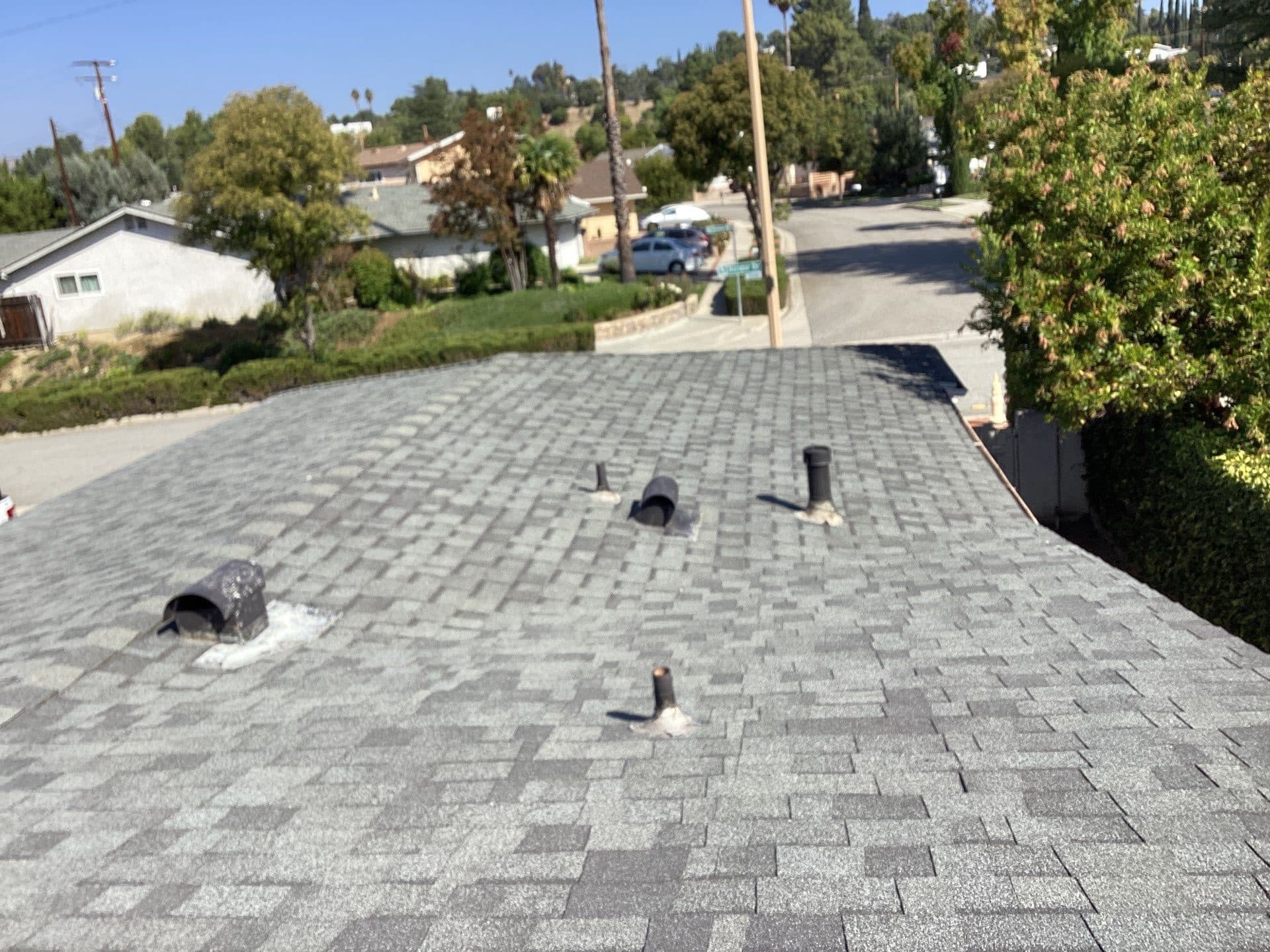 Gray asphalt shingle roof with pipe boots and vent stacks in Calabasas | Roof Replacement Inc gray asphalt shingle roof with pipe boots and vent stacks — Calabasas — Roof Replacement Inc