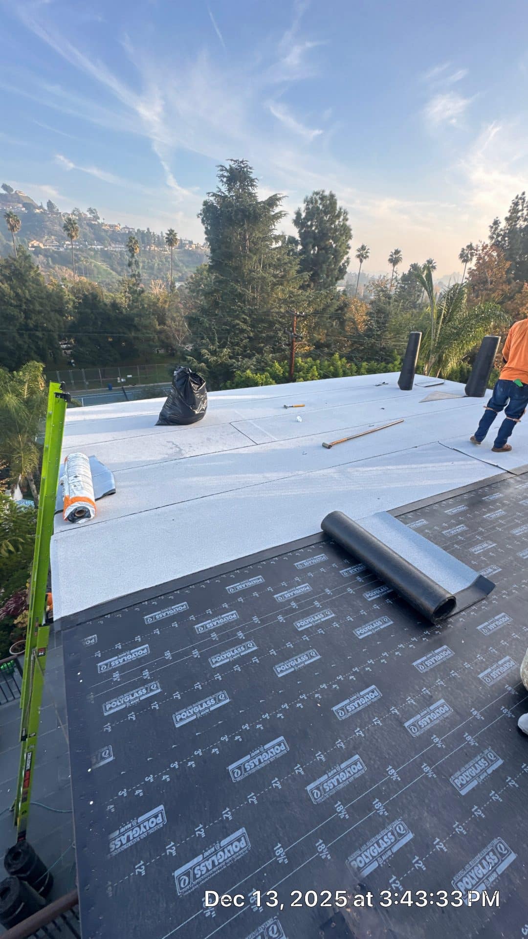 Polyglass underlayment and white cap sheet installation on flat roof — Glendale — Roof Replacement Inc